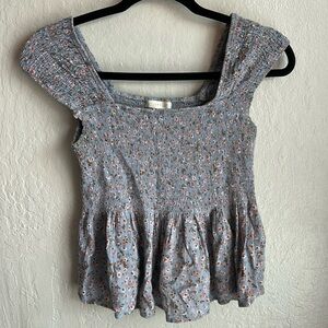 Woman’s size L blue floral print fitted and flowy top